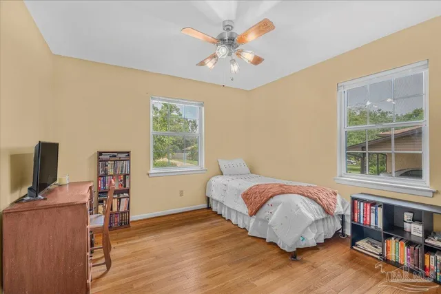 a bed room with a bed and a window