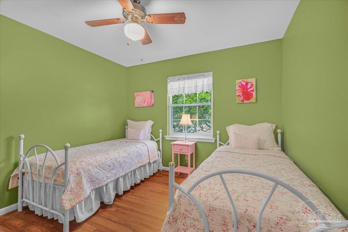 2021 Morningside Drive Pensacola, FL 32503 - Photo 33 of 44 a spacious bedroom with two beds and a chandelier