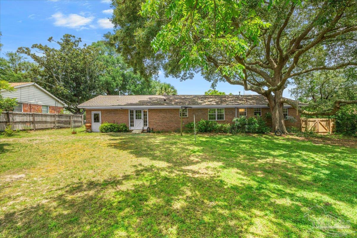2021 Morningside Drive Pensacola, FL 32503 - Photo 36 of 44 a front view of a house with a garden