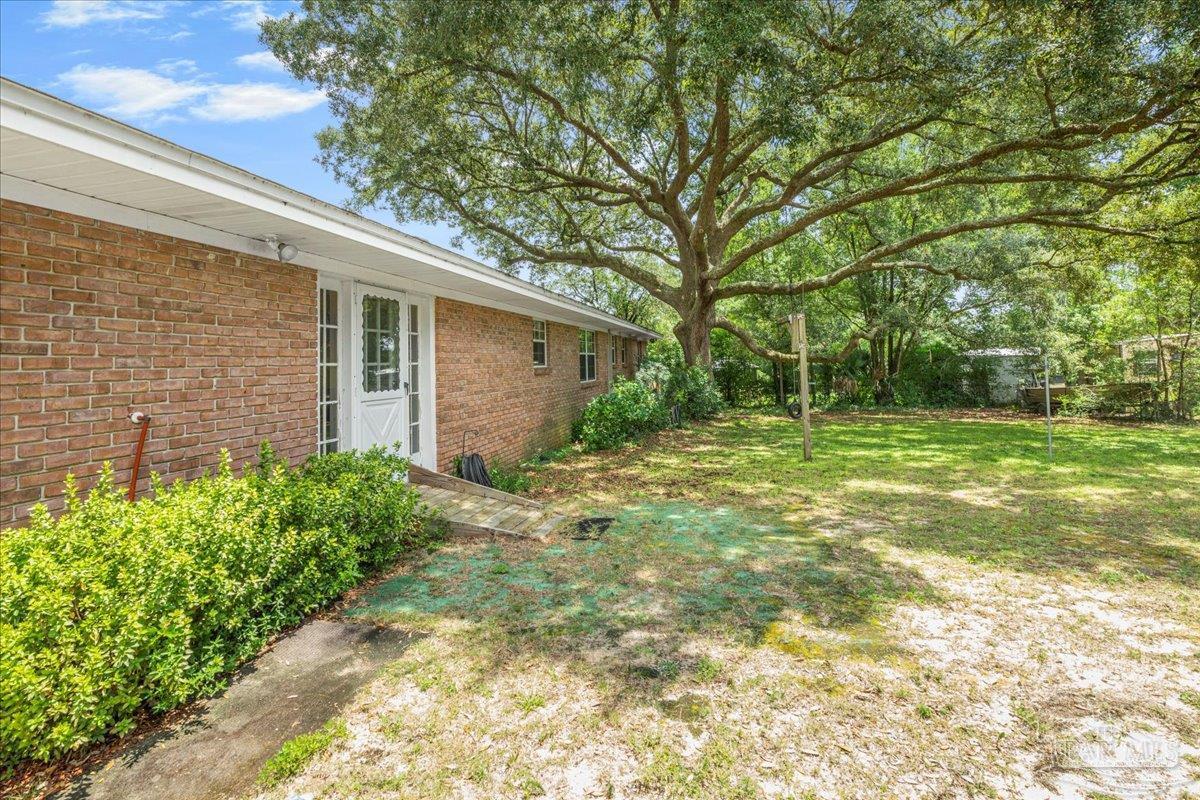 2021 Morningside Drive Pensacola, FL 32503 - Photo 37 of 44 a backyard of a house with lots of green space