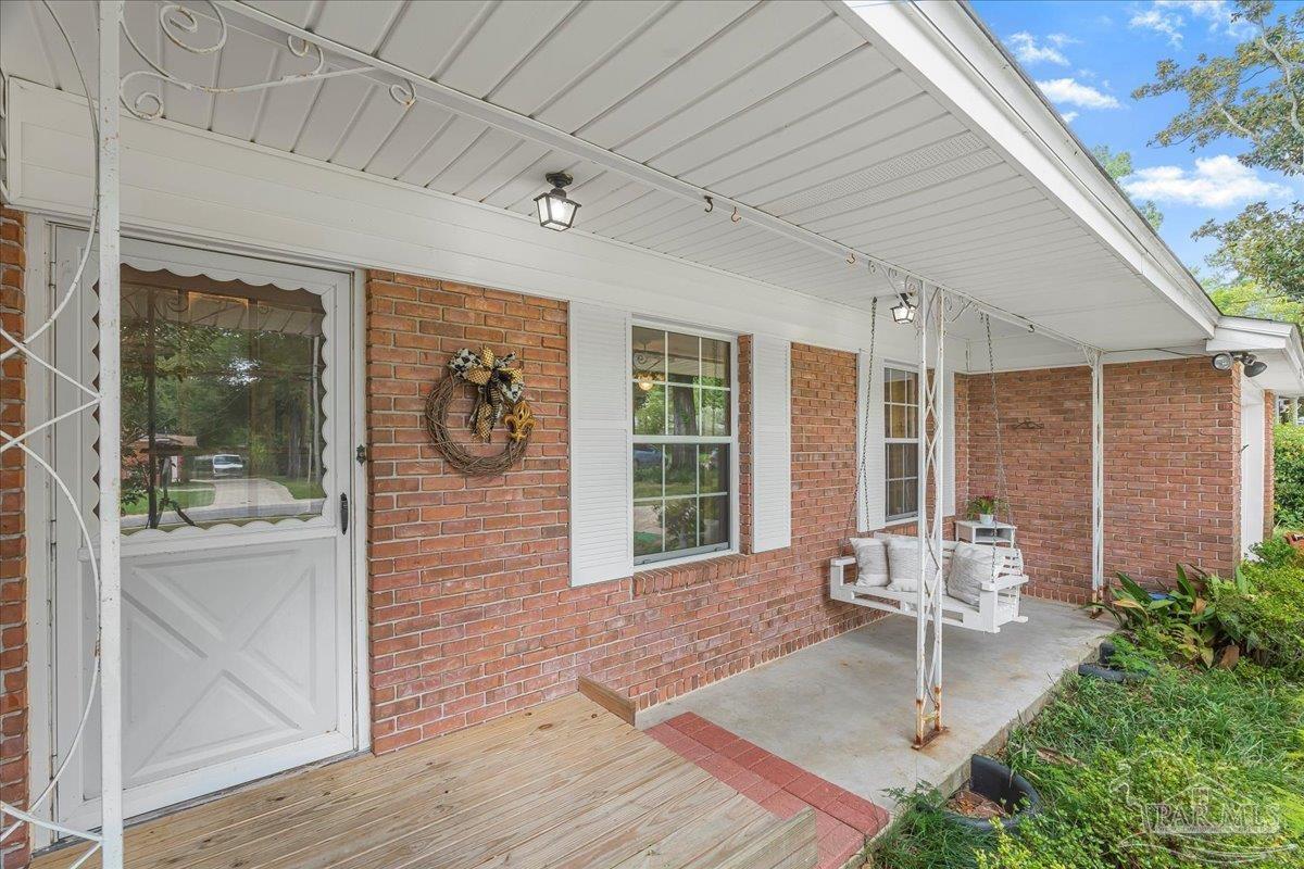 2021 Morningside Drive Pensacola, FL 32503 - Photo 10 of 44 a front view of a house with garden