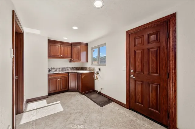 a view of a livingroom with furniture and window