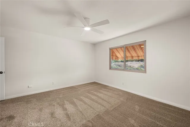 a view of a backyard with sitting area
