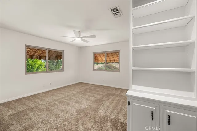 a view of swimming pool with outdoor seating