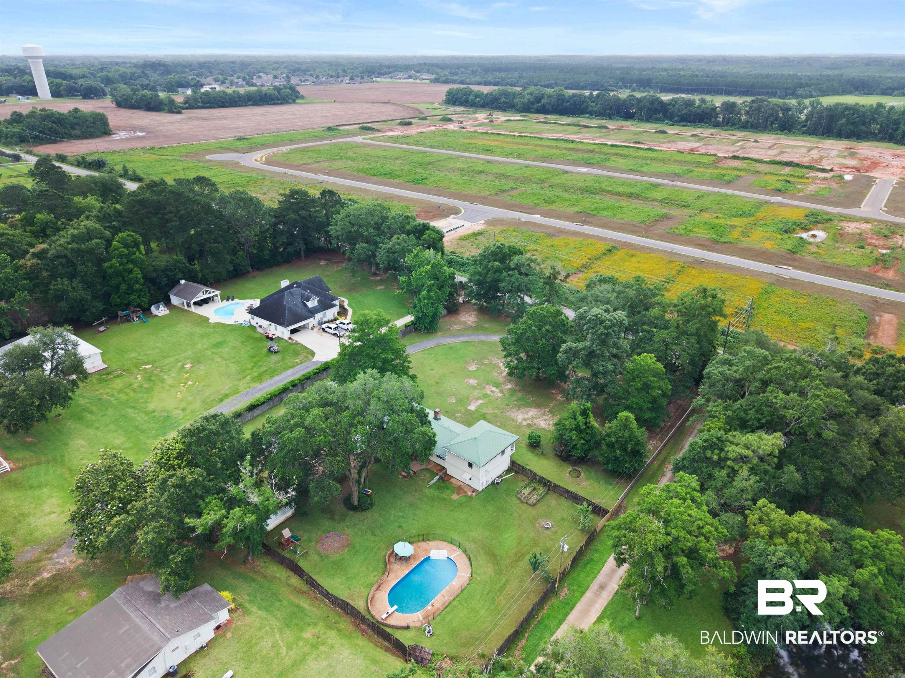 10420 Johnson Road South Mobile, AL 36695 - Photo 71 of 75 Expansive property featuring two residences, two private pools, and a detached garage/outbuilding, all set on large lots with mature trees and paved driveways
