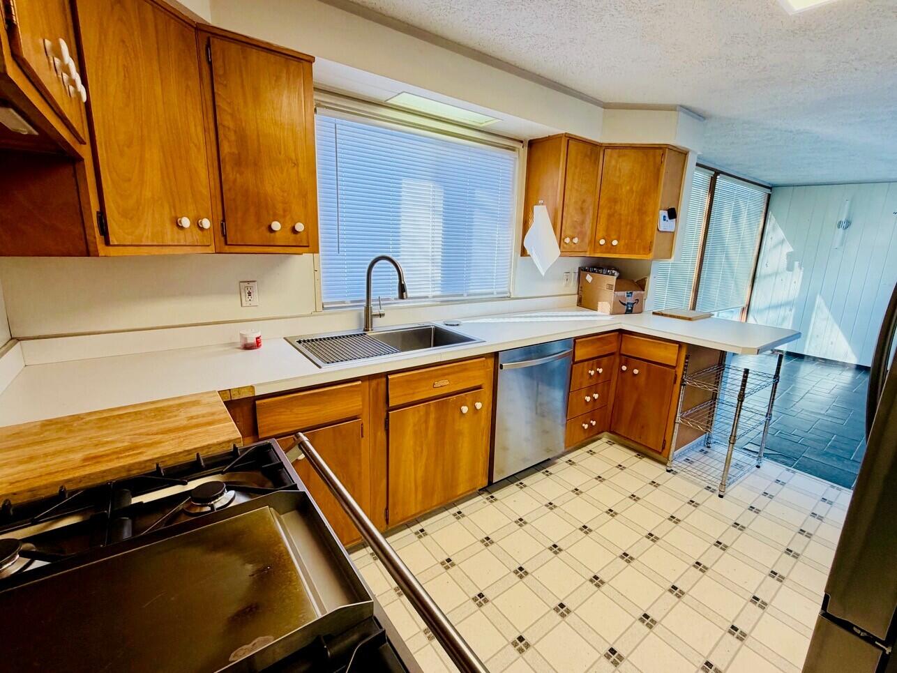 2401 Maple Street Michigan City, IN 46360 - Photo 2 of 12 a kitchen with a sink appliances and cabinets
