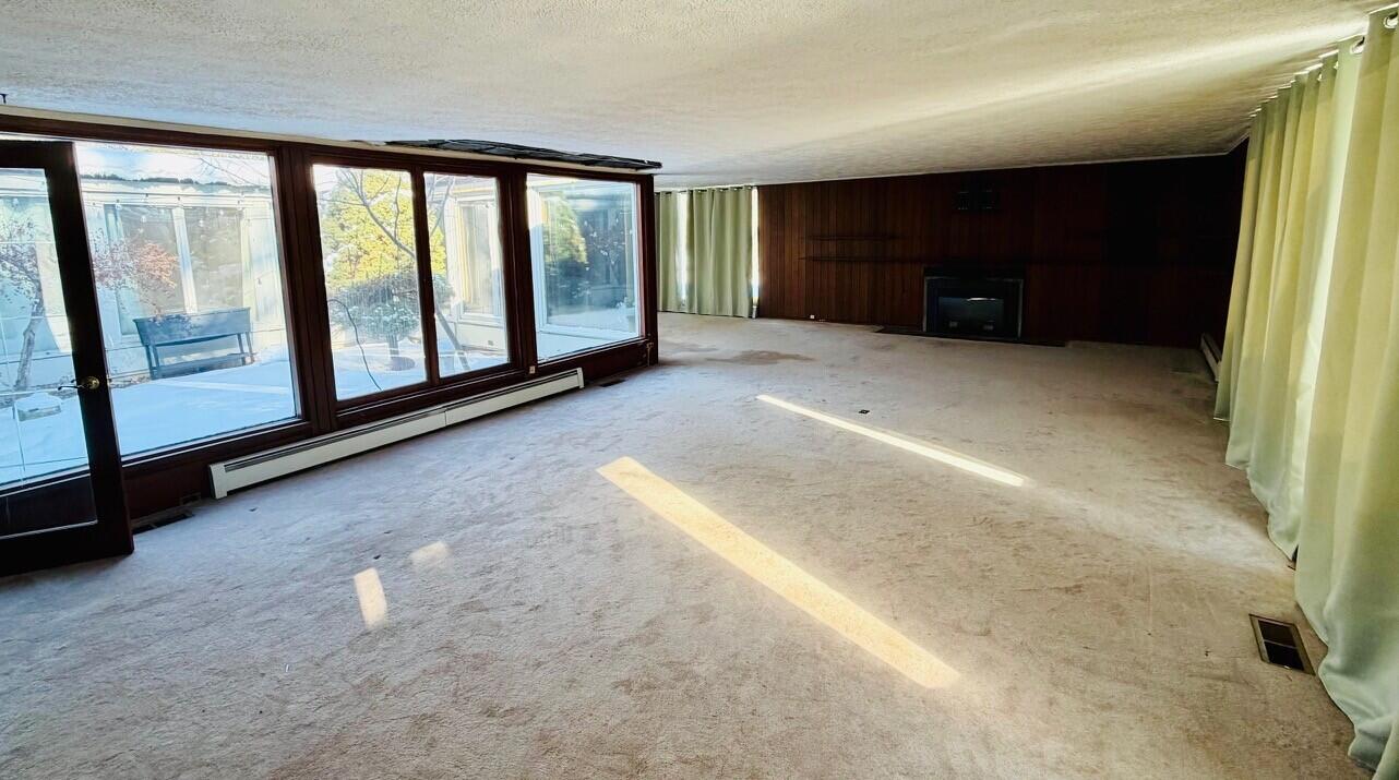 2401 Maple Street Michigan City, IN 46360 - Photo 6 of 12 a view of a livingroom with an empty space and balcony