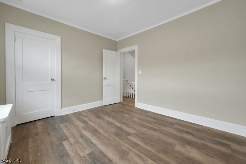 5 Gates Avenue Summit, NJ 07901 - Photo 14 of 24 a view of an empty room with wooden floor and a window