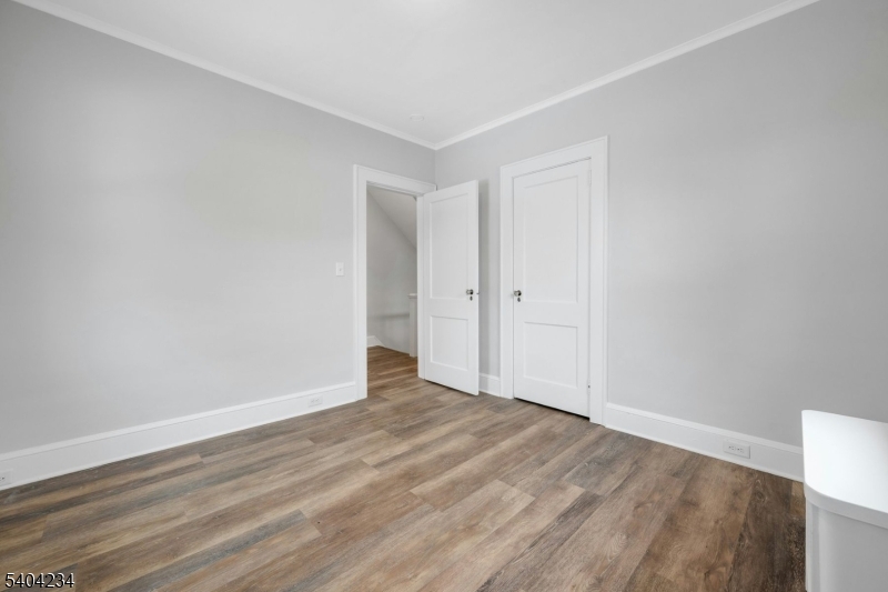 5 Gates Avenue Summit, NJ 07901 - Photo 16 of 24 a view of an empty room with wooden floor