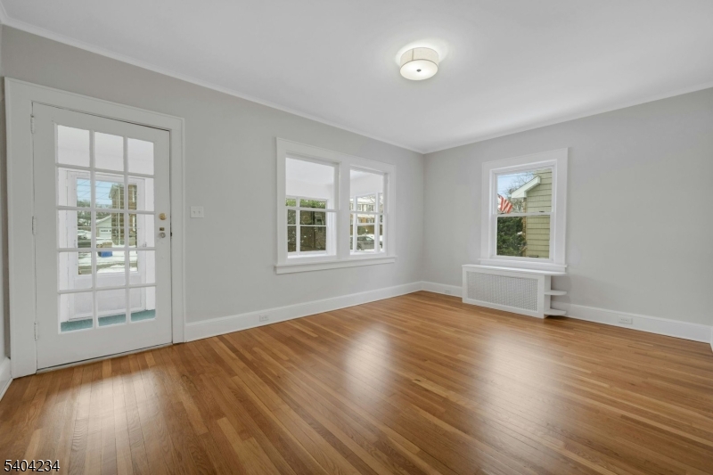 5 Gates Avenue Summit, NJ 07901 - Photo 2 of 24 a view of empty room with wooden floor and fan