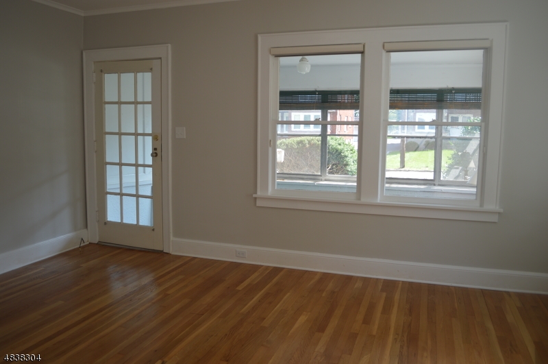 5 Gates Avenue Summit, NJ 07901 - Photo 3 of 14 a view of an empty room with wooden floor and a window