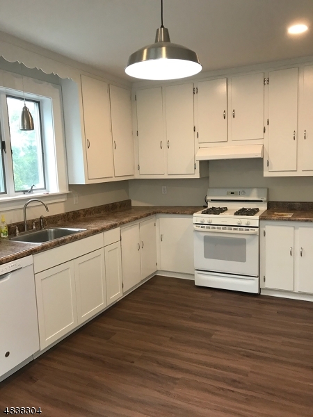 5 Gates Avenue Summit, NJ 07901 - Photo 6 of 14 a kitchen with granite countertop a sink cabinets and wooden floor