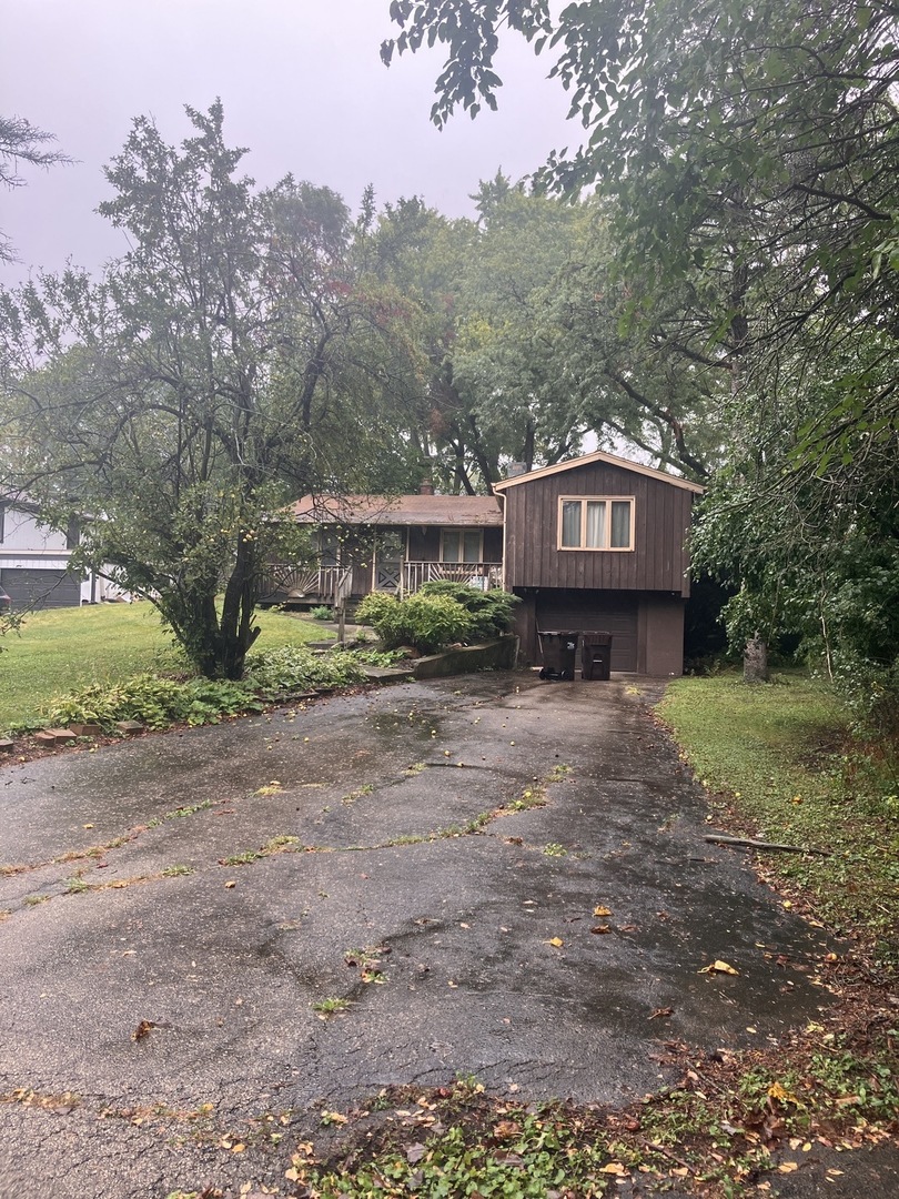 412 Meadow Lane Lake Zurich, IL 60047 - Photo 1 of 9 a view of a house with a yard and a large tree