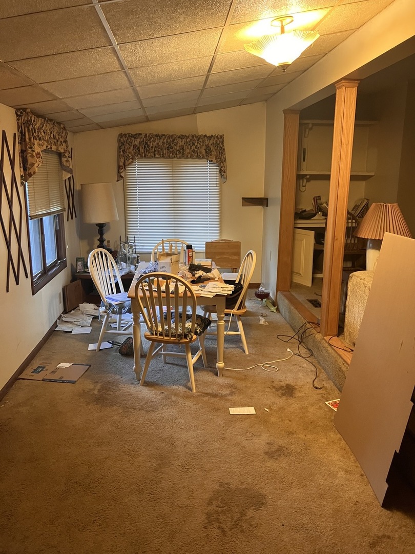 412 Meadow Lane Lake Zurich, IL 60047 - Photo 4 of 9 a dining room with furniture and window