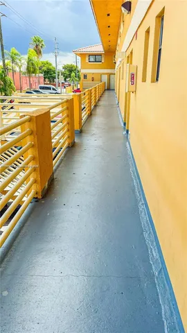a view of a balcony with an outdoor seating