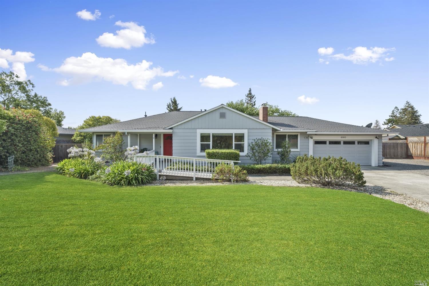 4980 Badger Road Santa Rosa, CA 95409 - Photo 1 of 1 a front view of a house with garden and porch