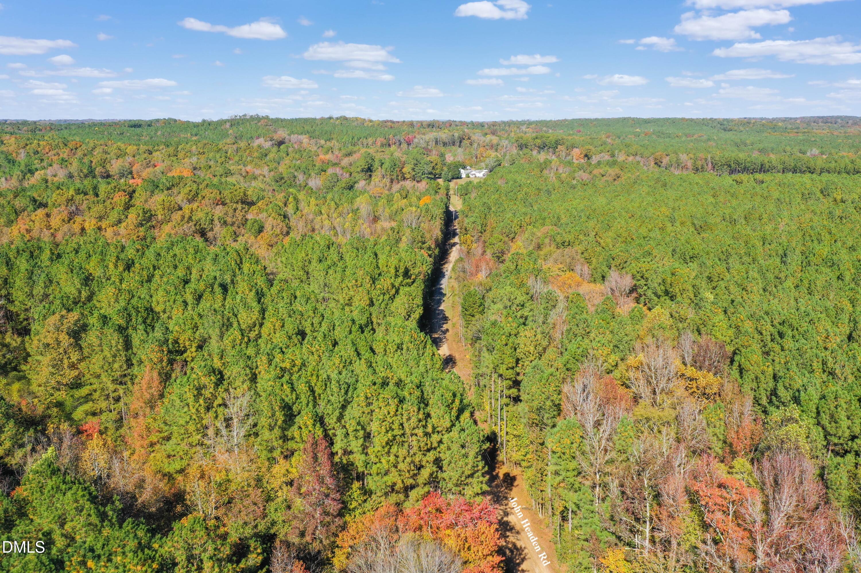 278 John Headen Road Moncure, NC 27559 - Photo 3 of 14 a view of a city with lush green forest