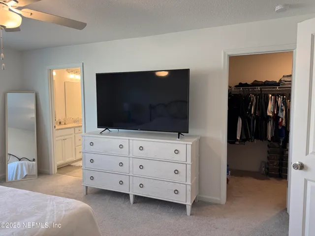 a bathroom with a sink double vanity granite and a mirror