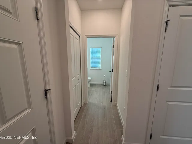 a view of a bathroom from a hallway