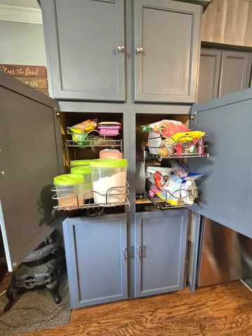 a view of a dining room with furniture wooden floor and chandelier
