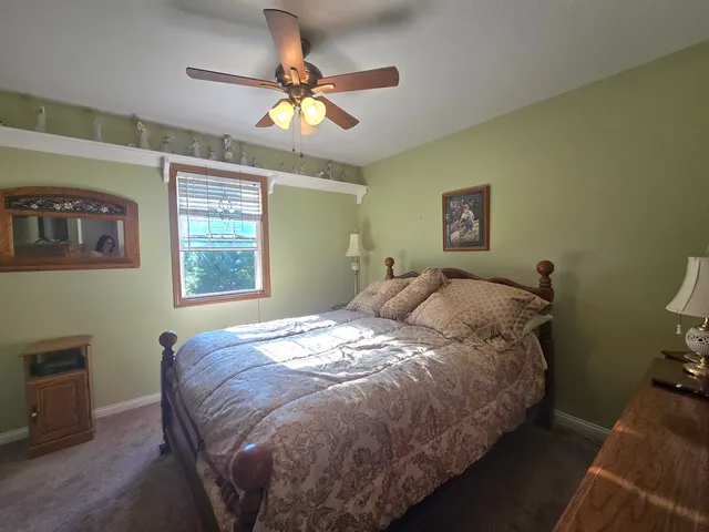 a bathroom with a toilet a sink and a mirror
