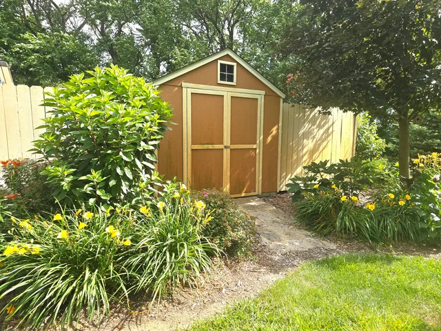 a garden with flowers and trees
