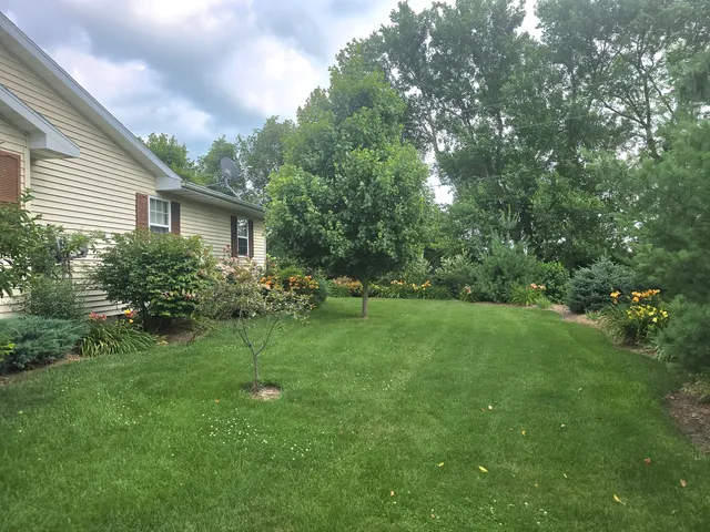 a front view of a house with a garden and porch