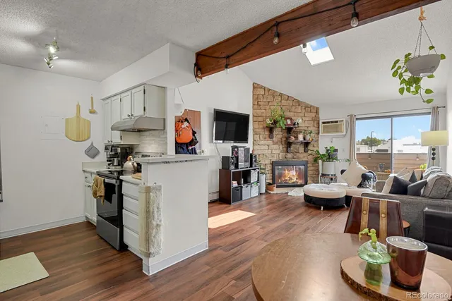 a kitchen with stainless steel appliances a stove a sink and a microwave