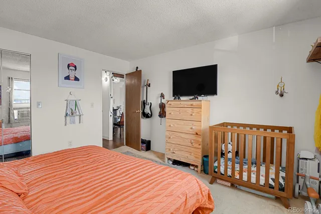 a bathroom with a sink a mirror a toilet and a shower