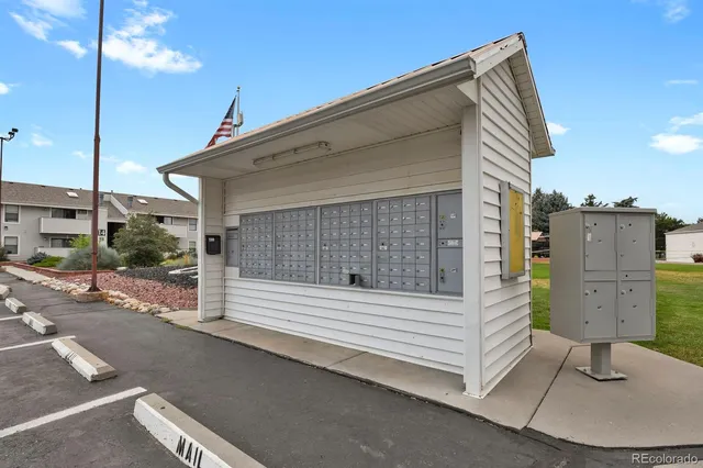a swimming pool with outdoor seating and yard