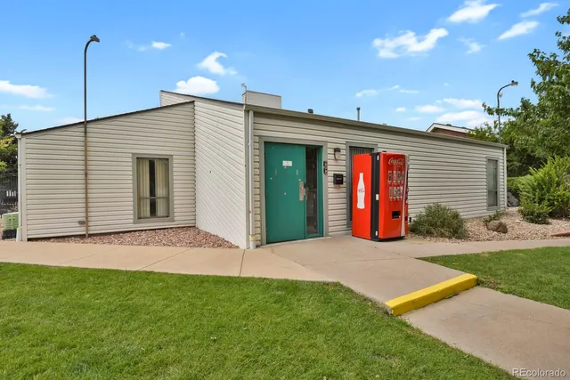 a view of house with swimming pool and porch with furniture