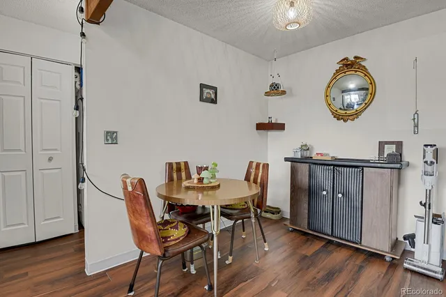 a kitchen with a table chairs and a stove