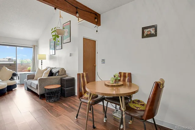a living room with fireplace furniture and a wooden floor