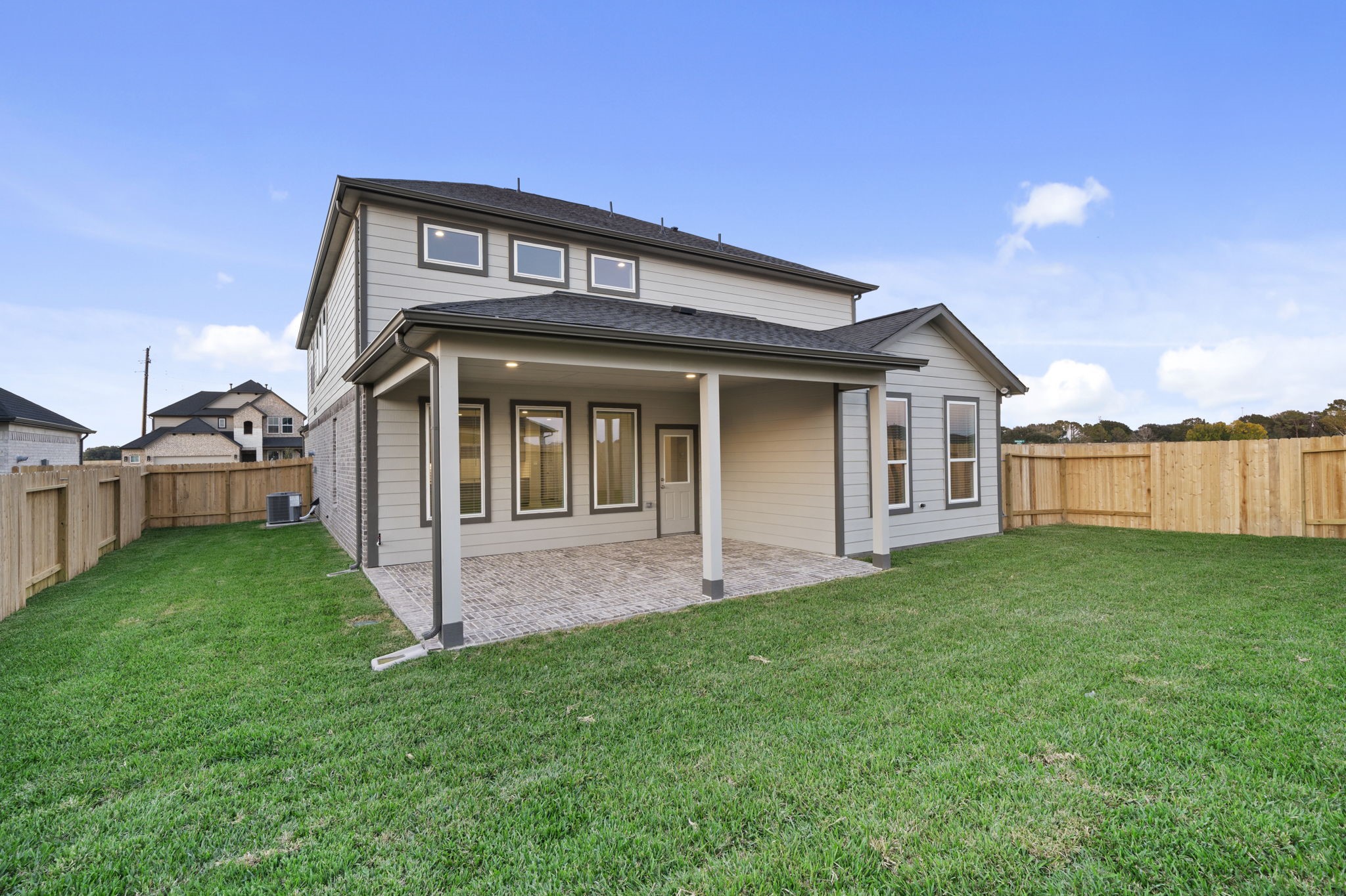 3015 Boulder Ridge Drive Rosenberg, TX 77471 - Photo 31 of 34 a front view of a house with a garden