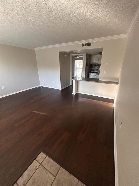 Undisclosed Address Altamonte Springs, FL 32701 - Photo 2 of 11 a view of empty room with wooden floor