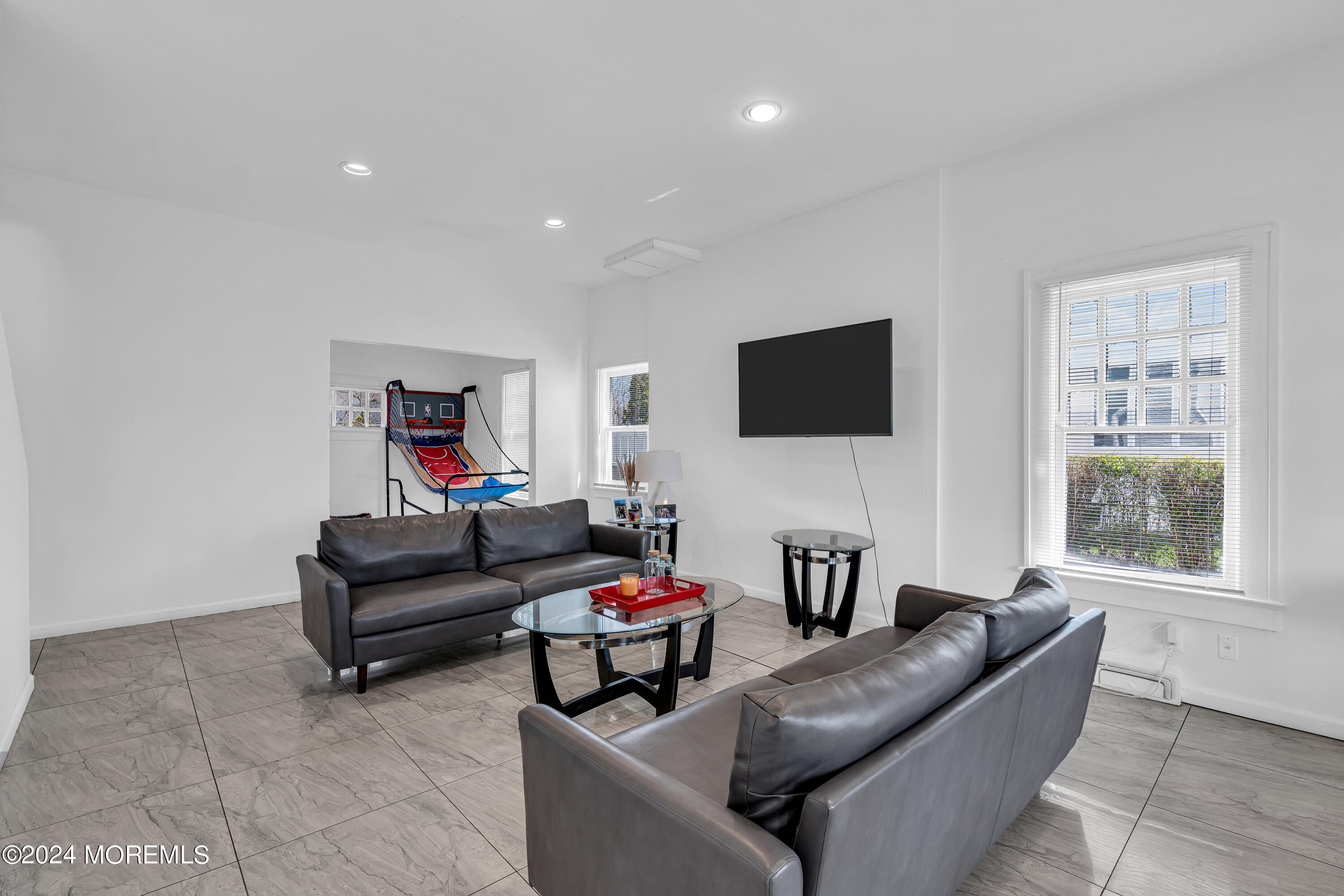 17 Lakeview Road Deal, NJ 07723 - Photo 7 of 30 a living room with furniture and a flat screen tv