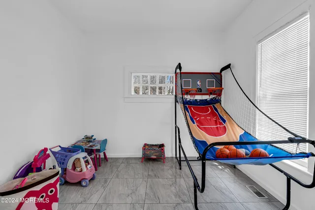 a room with toys and air hockey table