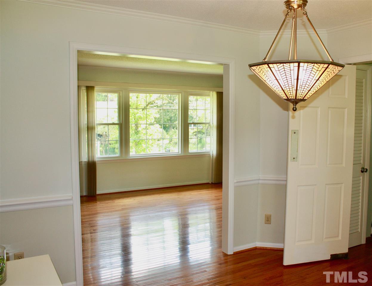 1009 Pebblebrook Drive Raleigh, NC 27609 - Photo 10 of 25 Dining Room opening to the living room.