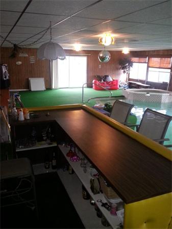61 Haverhill Road Amesbury, MA 01913 - Photo 13 of 16 a room with pool table and a potted plant