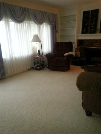 61 Haverhill Road Amesbury, MA 01913 - Photo 6 of 16 a living room with furniture and a fireplace