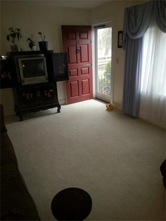 61 Haverhill Road Amesbury, MA 01913 - Photo 7 of 16 a view of an empty room with a fireplace