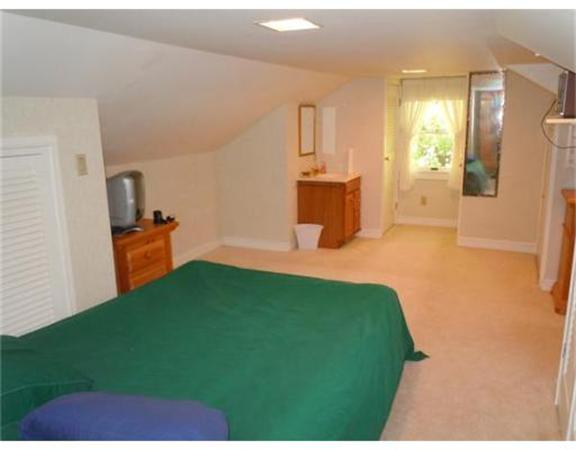 61 Haverhill Road Amesbury, MA 01913 - Photo 10 of 16 a bedroom with a bed and teddy bear on bed