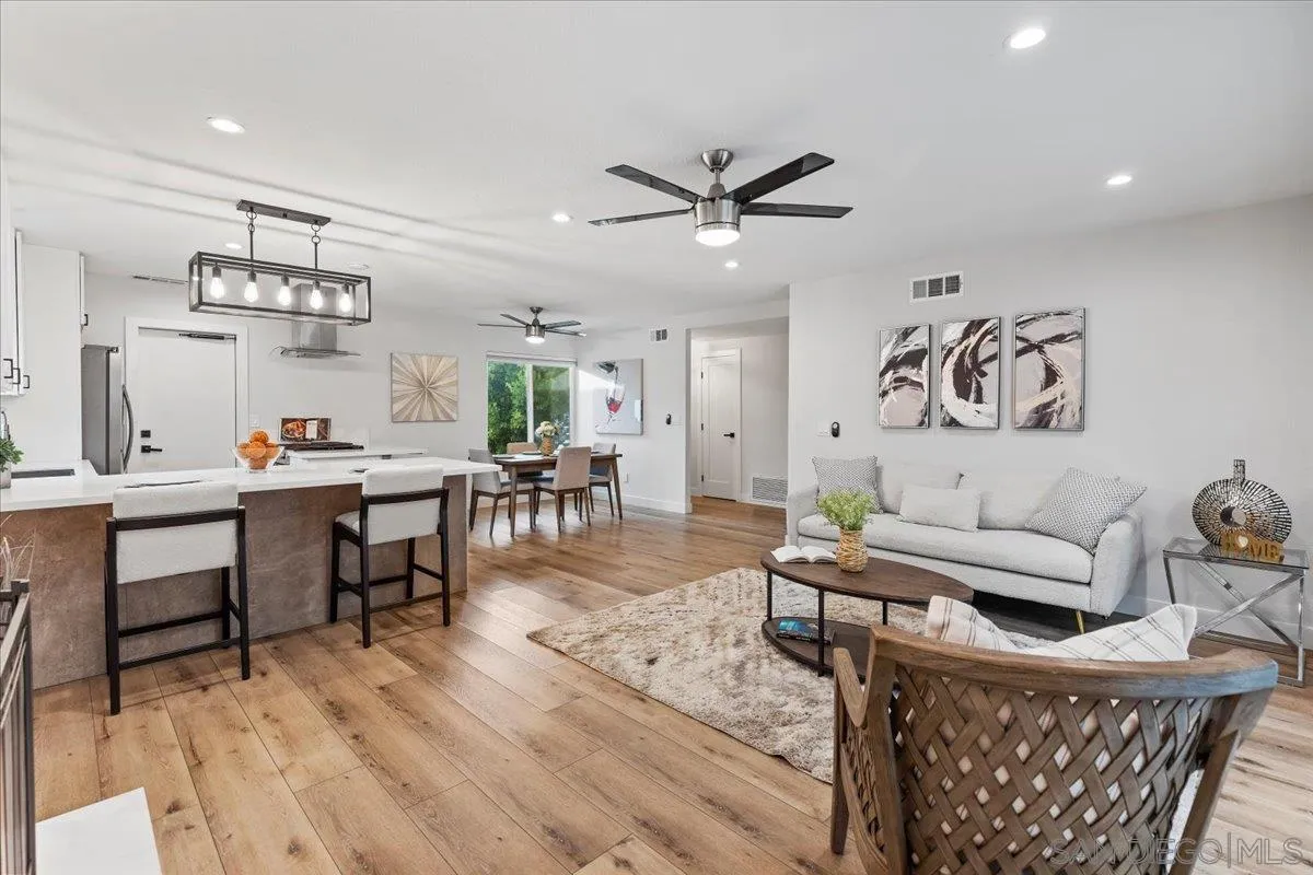 9737 Roe Drive Santee, CA 92071 - Photo 13 of 37 a living room with furniture and a wooden floor