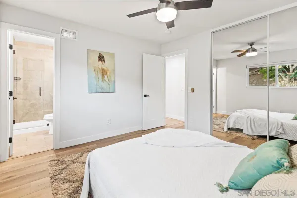 a bedroom with a bed and a view of bathroom