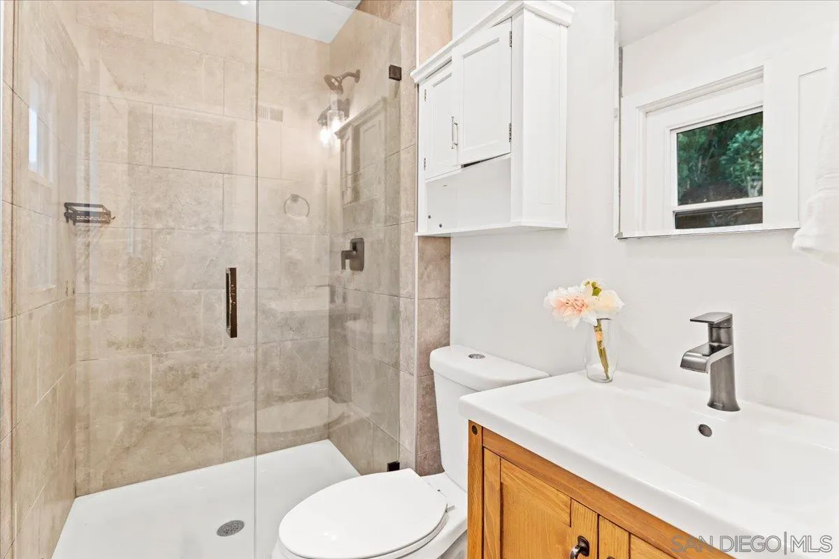 9737 Roe Drive Santee, CA 92071 - Photo 22 of 37 a bathroom with a sink toilet and shower