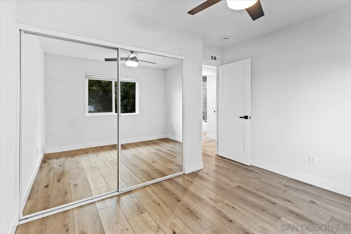 9737 Roe Drive Santee, CA 92071 - Photo 24 of 37 a view of empty room with wooden floor and fan
