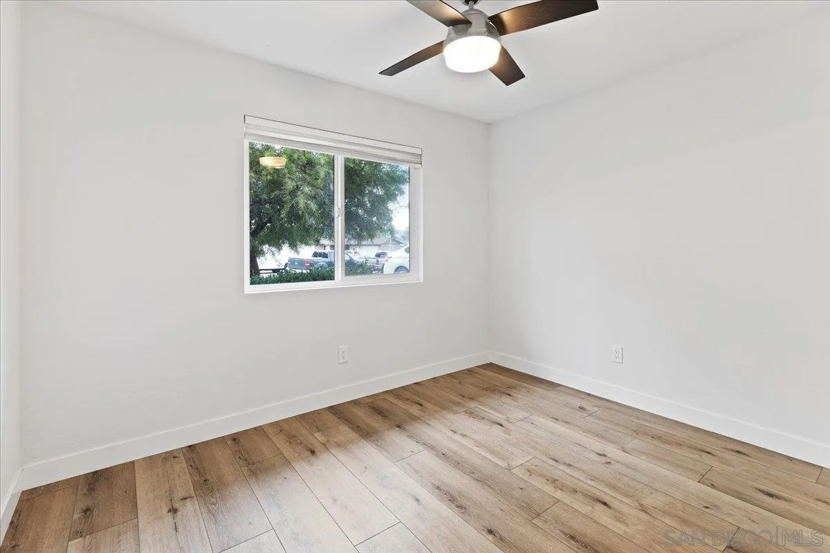 9737 Roe Drive Santee, CA 92071 - Photo 25 of 37 an empty room with a window and a ceiling fan