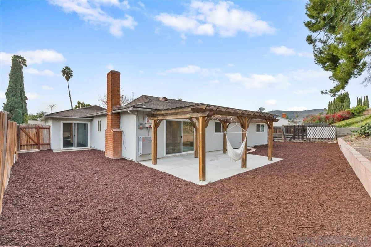 9737 Roe Drive Santee, CA 92071 - Photo 28 of 37 a front view of a house with a yard and garage