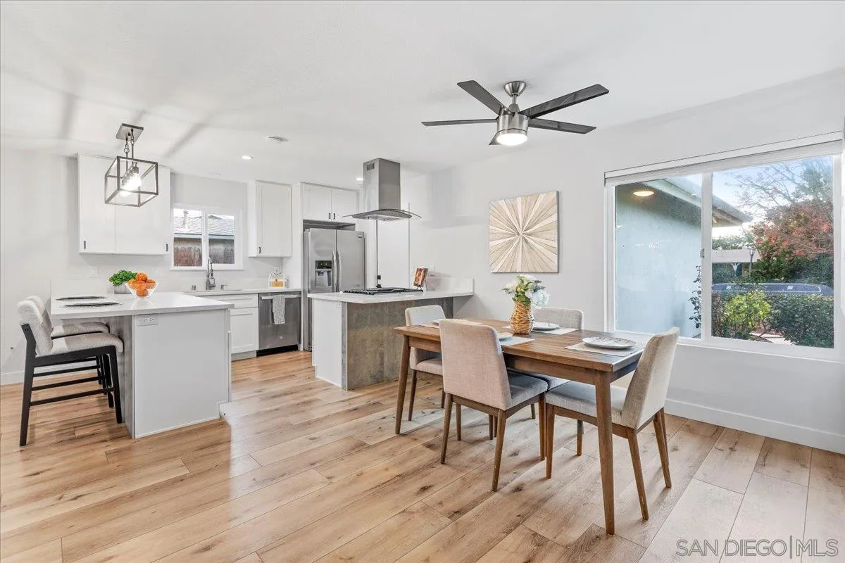 9737 Roe Drive Santee, CA 92071 - Photo 3 of 37 a view of a dining room with furniture and a window