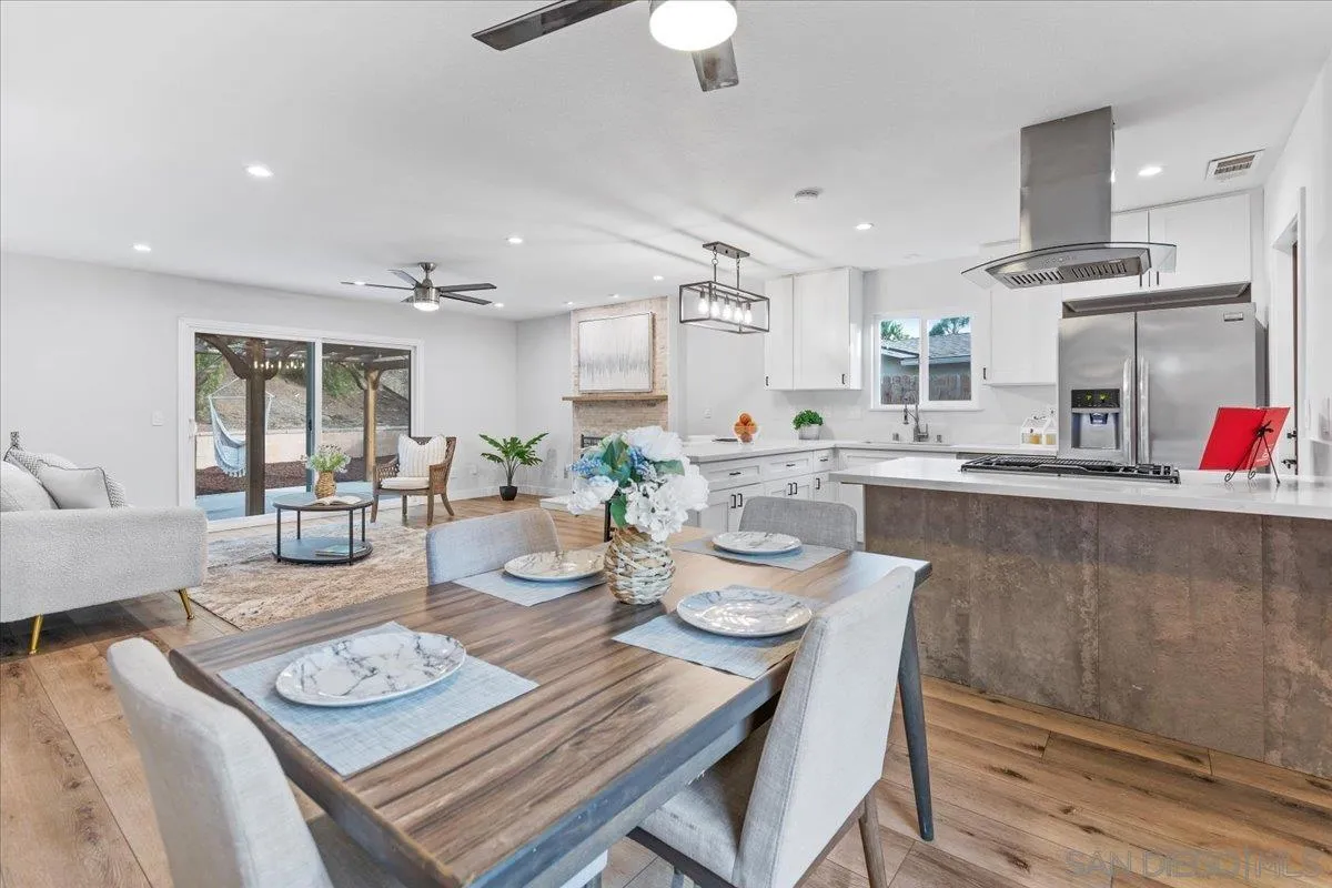 9737 Roe Drive Santee, CA 92071 - Photo 4 of 37 a view of a dining room with furniture and wooden floor